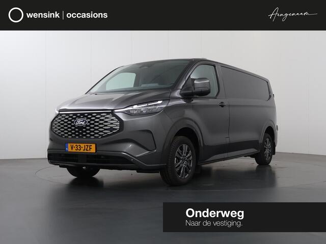Ford TRANSIT CUSTOM e-Transit 340 | L2 H1 | LIMITED | 65 kWh | 218 PK | 328 KM WLTP | ADAPTIVE CRUISE | LED | STOELVERWARMING | PARKEERPAKKET | NAVIGATIE | 2-ZITS | LAADRUIMTE PAKKET | SNEL LADEN | CARPLAY / ANDROID AUTO | 2300 KG AHW