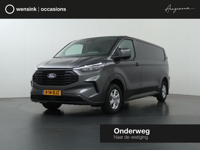 Ford TRANSIT CUSTOM 320 | 2.0 TDCI | L2 H1 | LIMITED | STOELVERWARMING | TREKHAAK | NAVIGATIE | CAMERA | PARKEERSENSOREN | METALLIC | LAADRUIMTE PAKKET | VOORRUITVERWARMING | 2-ZITS | STOEL STOEL | LM VELGEN