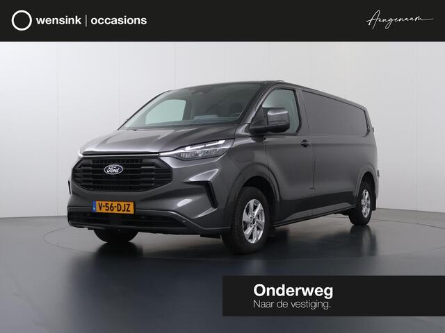 Ford TRANSIT CUSTOM 320 2.0 TDCI | L2 H1 | LIMITED | STOELVERWARMING | TREKHAAK | NAVIGATIE | CAMERA | PARKEERSENSOREN | METALLIC | LAADRUIMTE PAKKET | VOORRUITVERWARMING | 3-ZITS | LM VELGEN