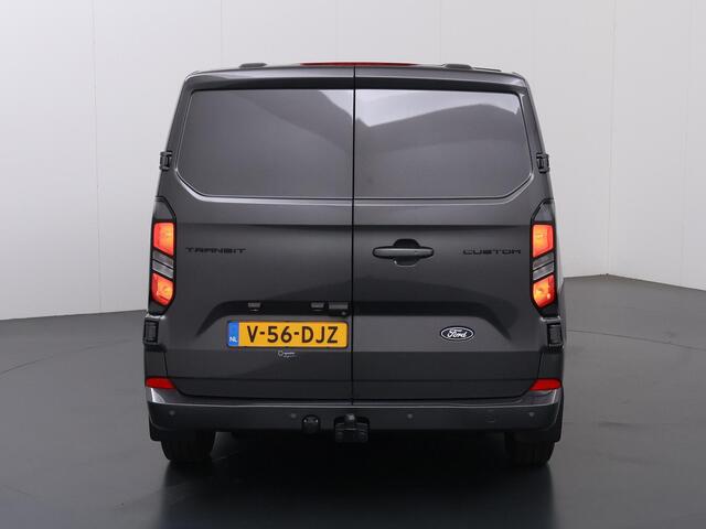 Ford TRANSIT CUSTOM 320 2.0 TDCI | L2 H1 | LIMITED | STOELVERWARMING | TREKHAAK | NAVIGATIE | CAMERA | PARKEERSENSOREN | METALLIC | LAADRUIMTE PAKKET | VOORRUITVERWARMING | 3-ZITS | LM VELGEN
