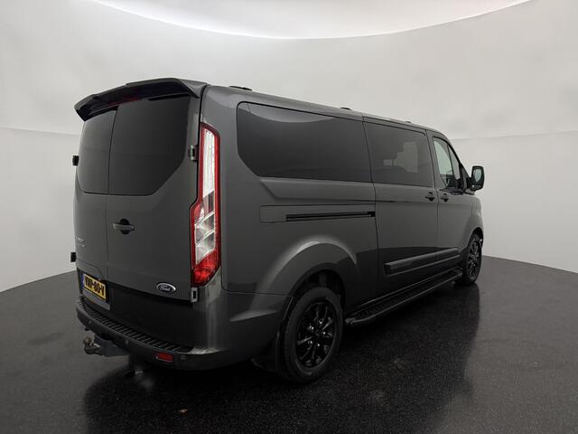 Ford TRANSIT CUSTOM 320 2.0 TDCI L2H1 Platinum Edition met o.a. een trekhaak, dodehoek detectie, elektrisch verwarmbare voorstoelen en een elektrisch verwarmbare voorruit