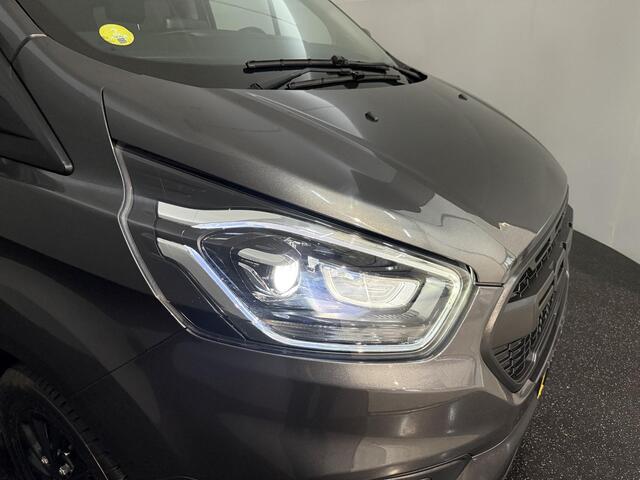 Ford TRANSIT CUSTOM 320 2.0 TDCI L2H1 Platinum Edition met o.a. een trekhaak, dodehoek detectie, elektrisch verwarmbare voorstoelen en een elektrisch verwarmbare voorruit