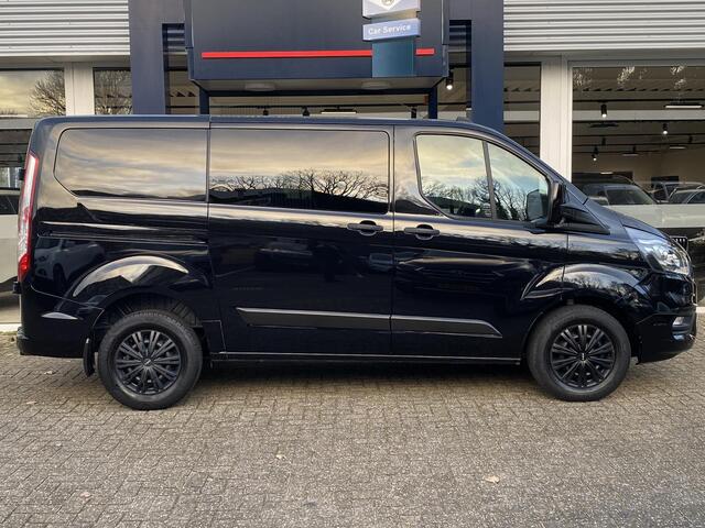 Ford TRANSIT CUSTOM 320 2.0 TDCI L1H1 Trend DC / Automaat / Dubbele-Cabine / Cruise-Control / Trekhaak / Stoelverwarming / Apple-Carplay & Android-Auto / Zijschuifdeur-Rechts / DAB Radio-Bluetooth / Navi / Verwarmde-Voorruit / PDC V+A met Camera / ENZ.
