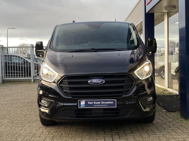 Ford TRANSIT CUSTOM 320 2.0 TDCI L1H1 Trend DC / Automaat / Dubbele-Cabine / Cruise-Control / Trekhaak / Stoelverwarming / Apple-Carplay & Android-Auto / Zijschuifdeur-Rechts / DAB Radio-Bluetooth / Navi / Verwarmde-Voorruit / PDC V+A met Camera / ENZ.