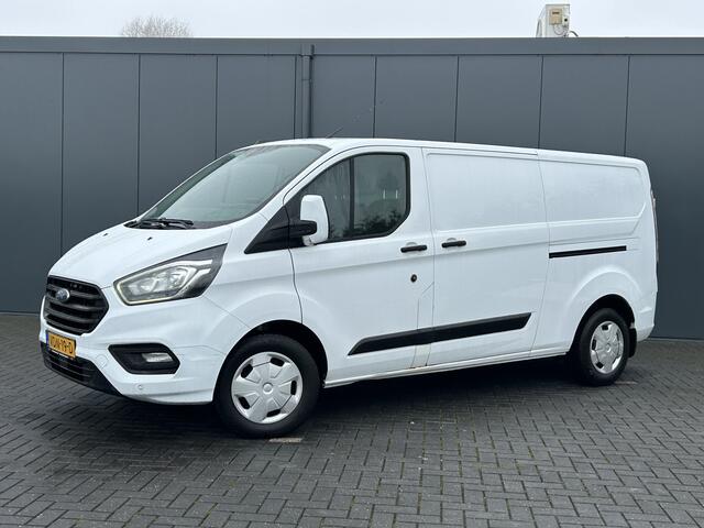 Ford TRANSIT CUSTOM 2.0 TDCI 130 PK / L2H1 / 2.800 KG AHG / 1e EIG. / 2x SCHUIFDEUR / TREKHAAK / CAMERA / AIRCO / CRUISE
