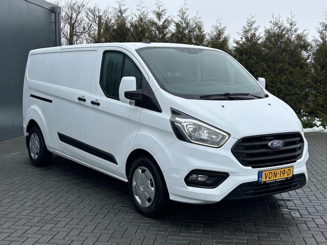 Ford TRANSIT CUSTOM 2.0 TDCI 130 PK / L2H1 / 2.800 KG AHG / 1e EIG. / 2x SCHUIFDEUR / TREKHAAK / CAMERA / AIRCO / CRUISE