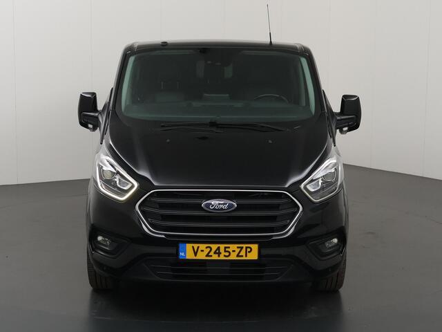 Ford TRANSIT CUSTOM 300 2.0 TDCI | L2 H1 | LIMITED | DUBBEL CABINE | AUT. | LEDEREN BEKLEDING | CAMERA | ADAPTIEVE CRUISE | STOELVERWARMING | NAVIGATIE | BI-XENON | 2X ZIJSCHUIFDEUR | AGATE BLACK METALLIC