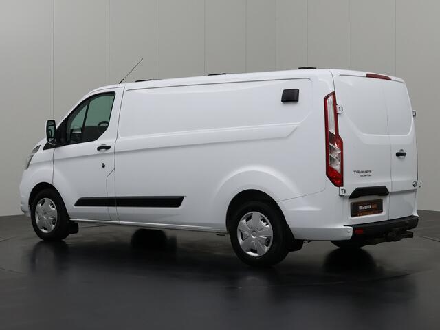 Ford TRANSIT CUSTOM 2.0TDCi 130PK Lang | Werkplaat inrichting | Dakdraagsysteem | Navigatie | Camera | Trekhaak | Airco | 3-Zits
