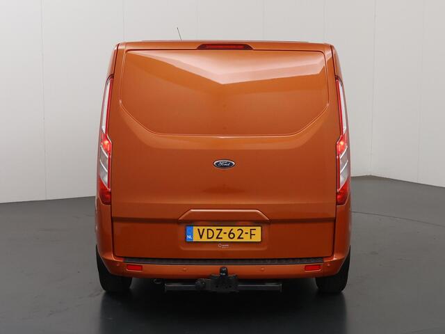Ford TRANSIT CUSTOM 300 | 2.0 TDCI | AUT. | L2 H1 | LIMITED | NL AUTO | DEALER ONDERHOUDEN | STOELVERWARMING | CRUISE CONTROL | AIRCO | PARKEERSENSOREN | METALLIC | ORANGE GLOW