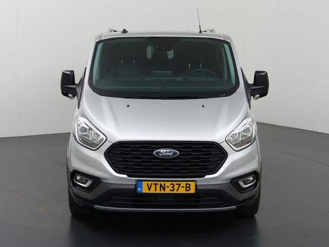 Ford TRANSIT CUSTOM 320 2.0 TDCI | L2 H1 | Active | Dubbele Cabine | Schuifdeur L + R | Trekhaak | LM Velgen | Treeplanken | 5-zits | Parkeercamera | Navigatie