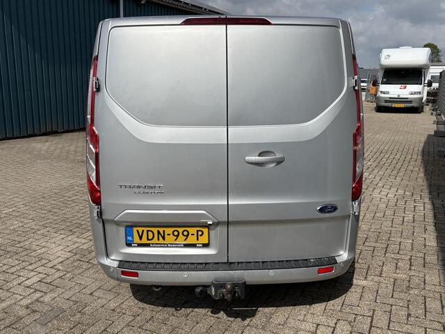 Ford TRANSIT CUSTOM 300 2.0 130Pk TDCI L2H1 Limited / Cruise / Airco / Navi / Trekhaak / Apk t/m 11-10-2026