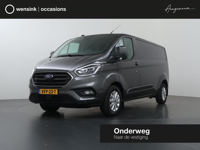 Ford TRANSIT CUSTOM 300 | 2.0 TDCI | Aut. | L2 H1 | Limited | Adaptive Cruise | Stoelverwarming | LM Velgen | 3-zits | Trekhaak | Navigatie | Parkeercamera | Apple Carplay