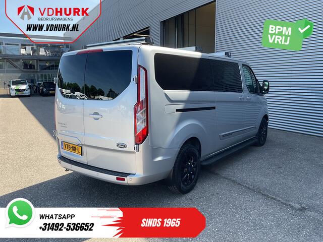 Ford TRANSIT CUSTOM 2.0 TDCI 130 pk Aut. DC Dubbel Cabine 2xSchuifdeur/ NL Auto/ Carplay/ Leder/ Stoelverw./ Navi/ Cruise/ Camera/ Airco/ Dakdragers/ 16"LMV/ PDC/ Sidesteps