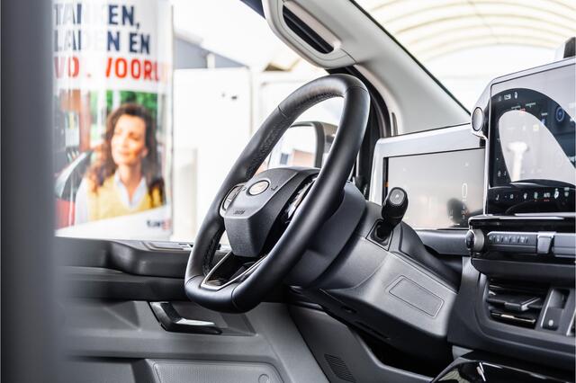 Ford TRANSIT CUSTOM E-Transit 340 L2H1 Sport 71 kWh | 350 KM Range | 360 Camera | Driving Assistant | L+R Schuifdeuren | DSS LED | Stoel/Stoel | Middenconsole | Navigatie | CarPlay | ACC | Blind Spot | Stuur- en stoelverwarming | Trekhaak | Dakdragers | E-Transit Custom | Ze