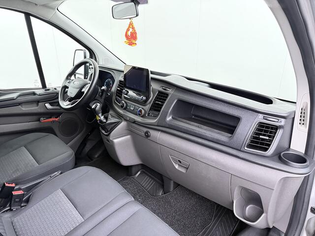 Ford TRANSIT CUSTOM 280 2.0TDCI 130PK Euro 6 L1H1 3-Persoons Navi Airco Cruise Control Bluetooth DAB Pdc Trend Betonplex Vloer Wandbetimmering Schuifdeur+Raam Achterdeuren+Ramen 1e Eigenaar