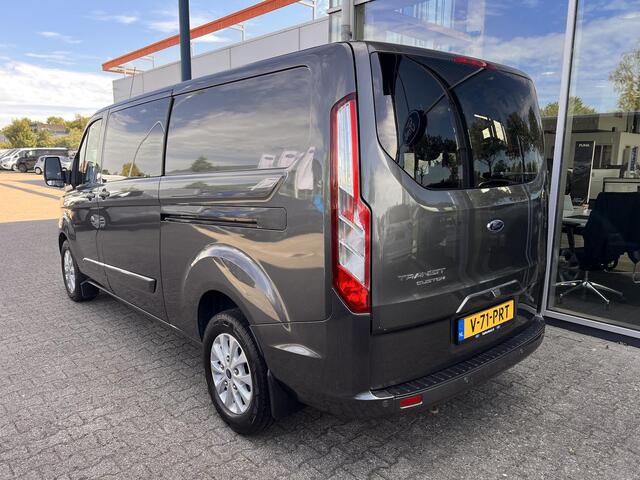 Ford TRANSIT CUSTOM 320 2.0 TDCI L2H1 Limited DC | 125.000 KM | Betimmerde Laadruimte | Navigatie | Adaptieve Cruise Control | Stoelverwarming |