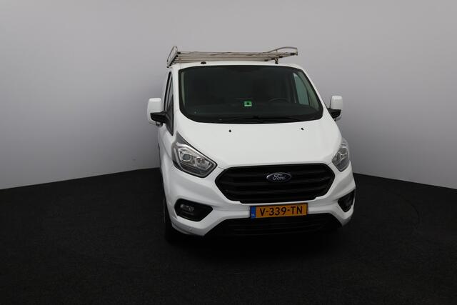 Ford TRANSIT CUSTOM 280 2.0 TDCI L1H1 Trend/ D-Riem verv: 144.000 Km!/ Trekhaak/ Automaat!/ Apple Carplay/ DAB+/ Voorruitverw./ Stoelverw./ PDC V+A/ Navi/ Clima/ Cruise/ Elek. pakket/ Bluetooht/ Multi. LEDER. Stuur/ PDC V+A.