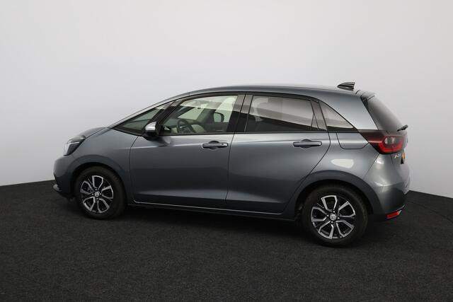 Honda JAZZ 1.5 e:HEV Executive/ LED Koplampen/ Camera/ Apple + Android/ DAB+/ Stoelverw./ Lane-Assist./ Adaptive Cruise/ Dode-Hoek DET./ Keyless/ Navi/ Multi. LEDER. Stuur/ PDC V+A/ Extra getint glas.