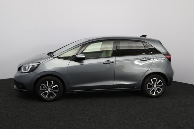 Honda JAZZ 1.5 e:HEV Executive/ LED Koplampen/ Camera/ Apple + Android/ DAB+/ Stoelverw./ Lane-Assist./ Adaptive Cruise/ Dode-Hoek DET./ Keyless/ Navi/ Multi. LEDER. Stuur/ PDC V+A/ Extra getint glas.