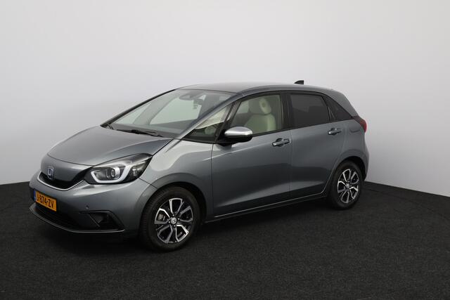Honda JAZZ 1.5 e:HEV Executive/ LED Koplampen/ Camera/ Apple + Android/ DAB+/ Stoelverw./ Lane-Assist./ Adaptive Cruise/ Dode-Hoek DET./ Keyless/ Navi/ Multi. LEDER. Stuur/ PDC V+A/ Extra getint glas.