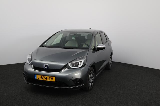 Honda JAZZ 1.5 e:HEV Executive/ LED Koplampen/ Camera/ Apple + Android/ DAB+/ Stoelverw./ Lane-Assist./ Adaptive Cruise/ Dode-Hoek DET./ Keyless/ Navi/ Multi. LEDER. Stuur/ PDC V+A/ Extra getint glas.