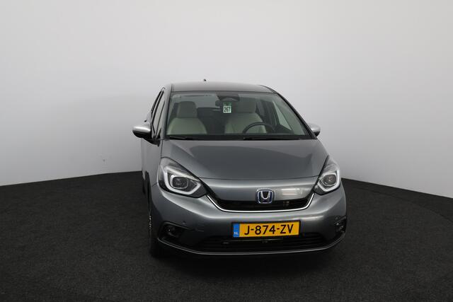 Honda JAZZ 1.5 e:HEV Executive/ LED Koplampen/ Camera/ Apple + Android/ DAB+/ Stoelverw./ Lane-Assist./ Adaptive Cruise/ Dode-Hoek DET./ Keyless/ Navi/ Multi. LEDER. Stuur/ PDC V+A/ Extra getint glas.