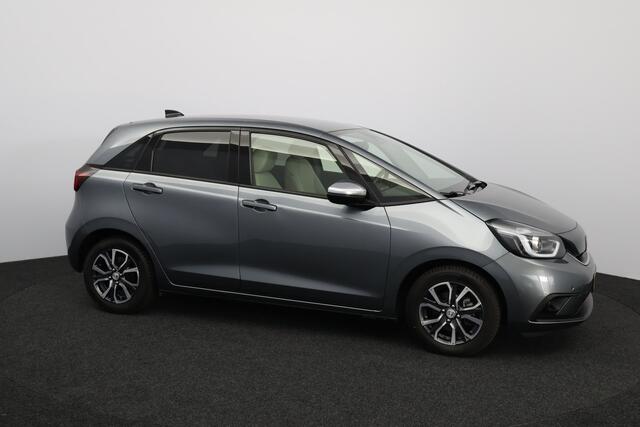 Honda JAZZ 1.5 e:HEV Executive/ LED Koplampen/ Camera/ Apple + Android/ DAB+/ Stoelverw./ Lane-Assist./ Adaptive Cruise/ Dode-Hoek DET./ Keyless/ Navi/ Multi. LEDER. Stuur/ PDC V+A/ Extra getint glas.