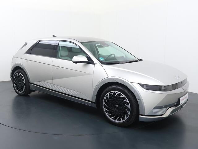 Hyundai IONIQ 5 Lounge 77.4 kWh | SoH 100% | Automaat | Multifunctioneel stuurwiel | Autohold | Automatische verlichting | Automatische achterklep | Inklapbare spiegels | Spraakbediening | Bluetooth | Stoelverwarming/Stoelventilatie | Climate | Navigatie | Apple Carpla