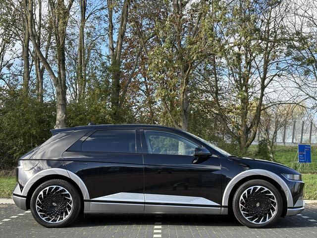 Hyundai IONIQ 5 Lounge AWD 77.4 kWh | Panoramadak | Lederen bekleding & memory functie | Warmtepomp & V2L | Geïntegreerde navigatie | Apple Carplay & Android Auto | Adaptieve Cruisecontrol | Camera | Warmtepomp | Stoel & stuur verwarming | Premium audio BOSE |