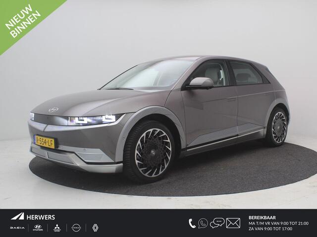 Hyundai IONIQ 5 Lounge AWD 77.4 kWh / BTW Auto / SoH 100% / Trekhaak / 1600kg Trekgewicht / Wit Lederen Bekleding / Dealer Onderhouden / Fabrieksgarantie tot 26-10-2027 / 1ste Eigenaar / NL Auto / AWD / Warmtepomp /