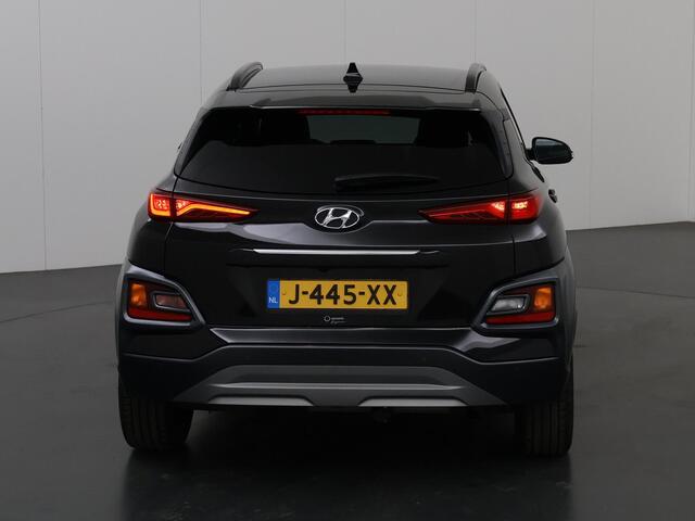 Hyundai Kona 1.6 GDI HEV Premium | Stoelverwarming | Stuurwielverwarming | Navigatiesysteem | Lederen bekleding | Camera | DAB | Apple CarPlay/Android Auto | Stoelkoeling | Adaptieve Cruise Control |