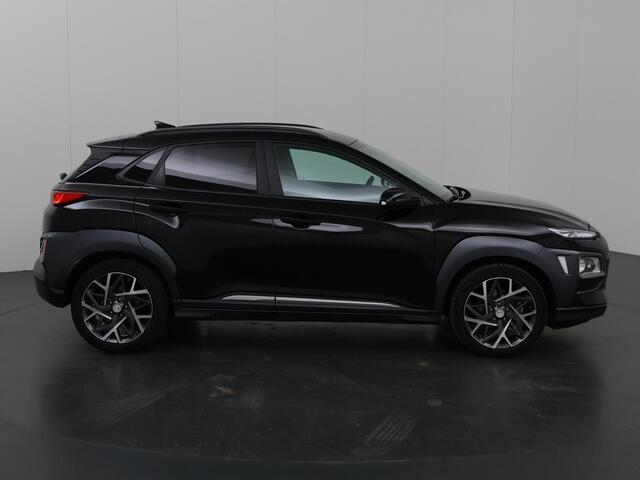 Hyundai Kona 1.6 GDI HEV Premium | Stoelverwarming | Stuurwielverwarming | Navigatiesysteem | Lederen bekleding | Camera | DAB | Apple CarPlay/Android Auto | Stoelkoeling | Adaptieve Cruise Control |