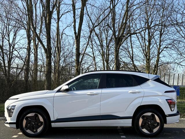 Hyundai Kona Electric Premium 65.4 kWh | Adaptieve cruisecontrol | Warmtepomp & V2L | Lederen bekleding & memory | Allseason banden |