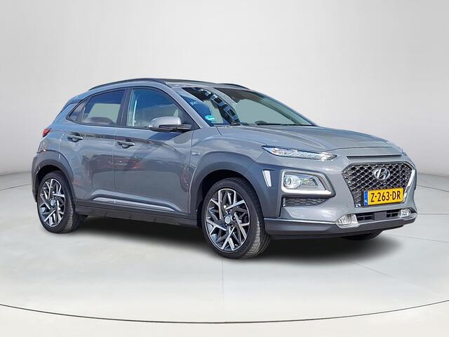 Hyundai Kona 1.6 GDI HEV Premium | Achteruitrijcamera | Stoel/stuurverwarming | Apple Carplay/Android Auto | Schuif/kanteldak | Head-up display | 36 Maanden garantie |