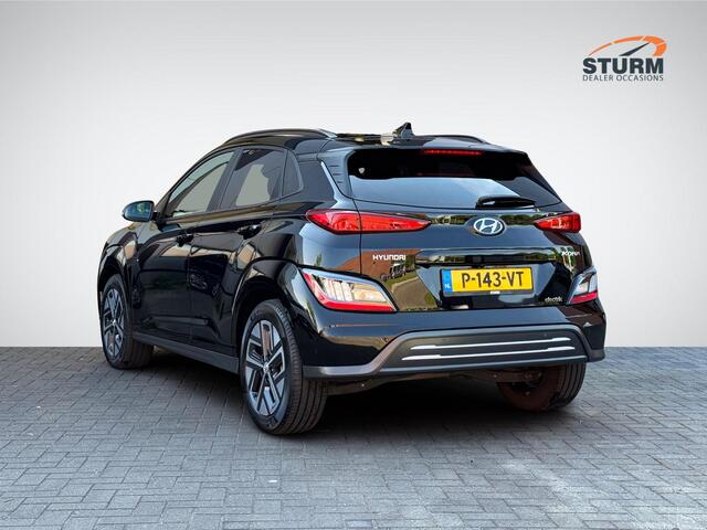 Hyundai Kona EV Fashion 64 kWh | Navigatie | Camera | Head-Up Display | Premium Audio | Adapt. Cruise Control | Dodehoek | Apple Carplay/Android Auto | Rijklaarprijs!