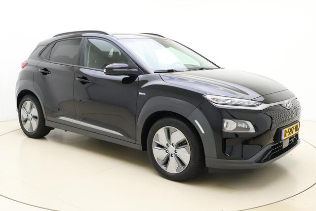 Hyundai Kona EV Premium Sky 64 kWh | Navigatie | Trekhaak | Climate control | Stoel & Stuurverwarming | Extra getint glas | Half leder | Keyless | Cruise control