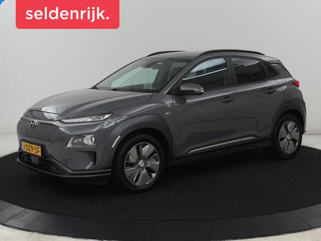 Hyundai Kona EV Premium 64 kWh | SOH 100% | 3 Fase | Stoelventilatie | Leder | Head-Up | Warmtepomp | Camera | Achterbankverwarming | Carplay | Navigatie | Adaptive cruise | Keyless | Parkeerhulp