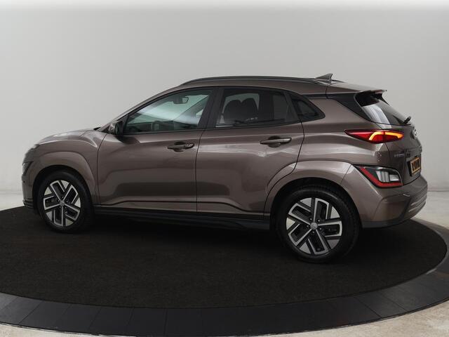 Hyundai Kona EV Fashion 64 kWh | SOH 100% | 3 Fase | Head-Up | Warmtepomp | Adaptive cruise | Camera | Carplay | Keyless | Full LED | Navigatie | Climate control