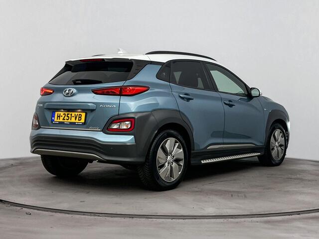Hyundai Kona EV Premium 64 kWh | Stoelverwarming & verkoeling | Achteruitrij camera | Navigatie | Adaptive cruise | Side skirts | All season banden |