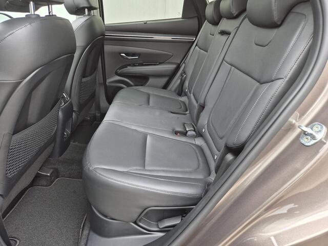 Hyundai TUCSON 1.6 T-GDI HEV 230 pk Premium Sky Automaat / 1650kg Trekgewicht / Glazen schuif- en kanteldak / Stuur- en Stoelverwarming / Adaptief cruise control / Stoelventilatie voor / Rondomzicht camera / Elektrische bedienbare achterklep /