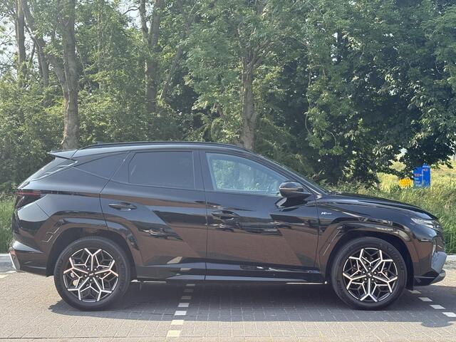 Hyundai TUCSON 1.6 T-GDI 230PK HEV N Line | 1650 kg trekvermogen | Geïntegreerde navigatiesysteem | Stoelverwarming | Android Auto & Apple Carplay | 19'' Lichtmetalen velgen |