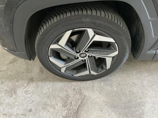 Hyundai TUCSON 1.6 T-GDI PHEV Premium Sky 4WD | Panoramadak | Afneembare trekhaak | 4WD | Stoelverwarming | Stoelventilatie | Lederen bekleding | Elektrische achterklep | KRELL | All season banden