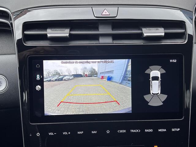 Hyundai TUCSON 1.6 T-GDI HEV Comfort Smart Automaat / Dealer onderhouden / Afneembare trekhaak 1.650 kg / Elektrische klep / Adaptieve CC / Stuur- & stoelverwarming / Navigatie / Camera / Apple Carplay Android / 19" LM + all season banden /