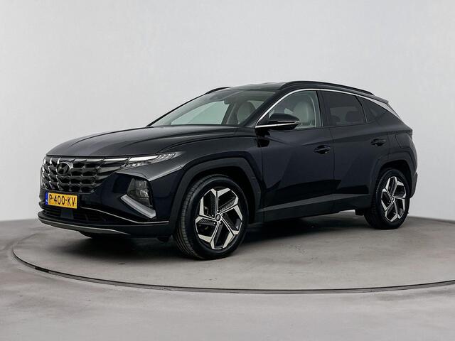 Hyundai TUCSON 1.6 T-GDI HEV Premium | Achteruitrij camera | Dodehoek detectie | Navigatie | Elektrische stoelen | Stoel verwarming & verkoeling |