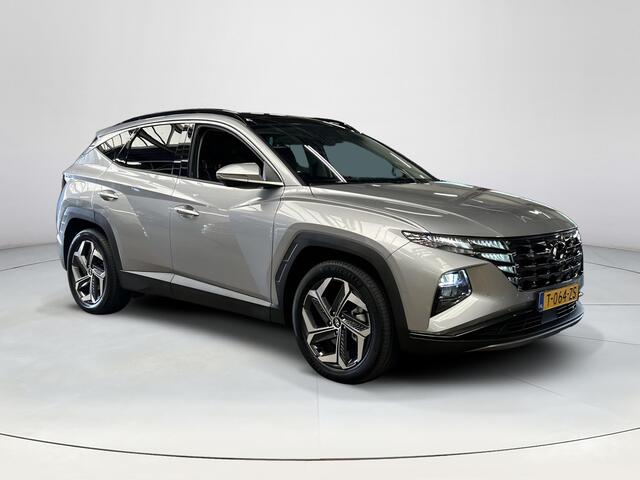 Hyundai TUCSON 1.6 T-GDI PHEV Premium Sky 4WD |Trekhaak| Panoramisch schuif/kantel dak | Apple Carplay/Android Auto | Stoelverwarming/verkoeling | Elektrische achterklep | Elektrische verstelbare stoelen met geheugen |