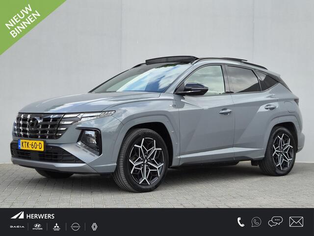 Hyundai TUCSON 1.6 T-GDI PHEV N Line Sky 4WD / SOH 100% / Fabrieksgarantie tot 12-2027 / Dealer onderhouden / Trekhaak afneembaar / Glazen schuif- en kanteldak / Trekgewicht 1350 kg / Adaptief cruise control / Rondomzicht camera / Stuur- Stoel & Achterbank verwarming /