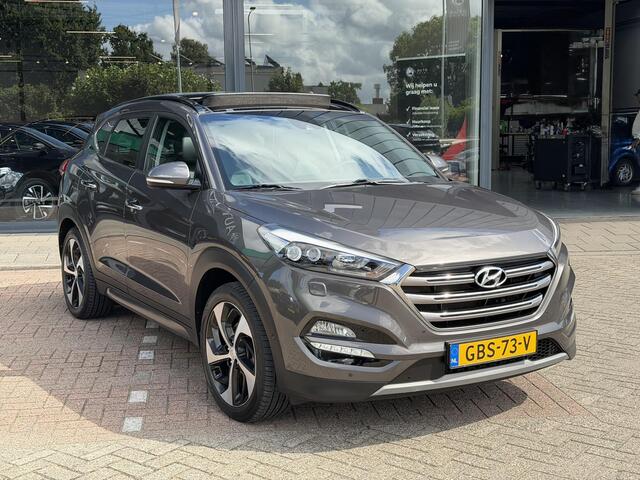 Hyundai TUCSON 1.6 T-GDi Premium 4WD LEDER | KEYLESS ENTRY/G | AUTOMAAT | AWD | CAMERA | ELEKTRISCH VERSTELBARE STOELEN | STOELVERWARMING | STUURVERWARMING | STUURKOELING | PANORAMADAK | NAVIGATIE | LED | XENON KOPLAMPEN | APPLE CARPLAY / ANDROID AUTO | CRUISECONTROL |