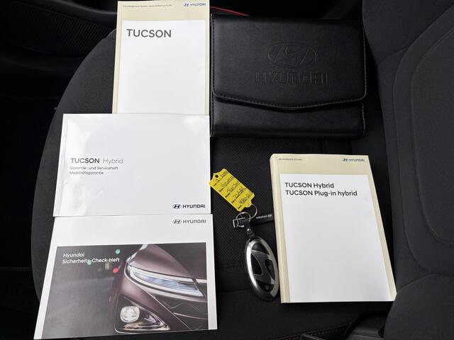 Hyundai TUCSON 1.6 T-GDI PHEV N Line Sky 4WD / Facelift / Fabrieksgarantie tot 12-2029 / Dealer onderhouden / Panorama schuifdak / Navigatie / Camera / Elektrische Achterklep / Stuur & Stoelverwarming / Apple Carplay Android / 19" LM wielen /
