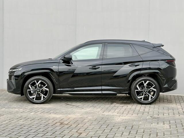 Hyundai TUCSON 1.6 T-GDI PHEV N Line Sky 4WD / Facelift / Fabrieksgarantie tot 12-2029 / Dealer onderhouden / Panorama schuifdak / Navigatie / Camera / Elektrische Achterklep / Stuur & Stoelverwarming / Apple Carplay Android / 19" LM wielen /