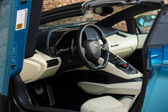 Lamborghini AVENTADOR S Roadster "Blu Aegir over Bianco Polar" "Blu Aegir over Bianco Polar" - First owner saw this color when it was introduced and just had to have it, And with extra blue contrasting stitching and lots of carbon fiber (Ad Personam), Manufacturer and dealer maintenance, The Dianthus wheels and Blu Aegir paint - If Lamborghini itself chose this combination for the launch - it can only be a good choise,Pristine condition